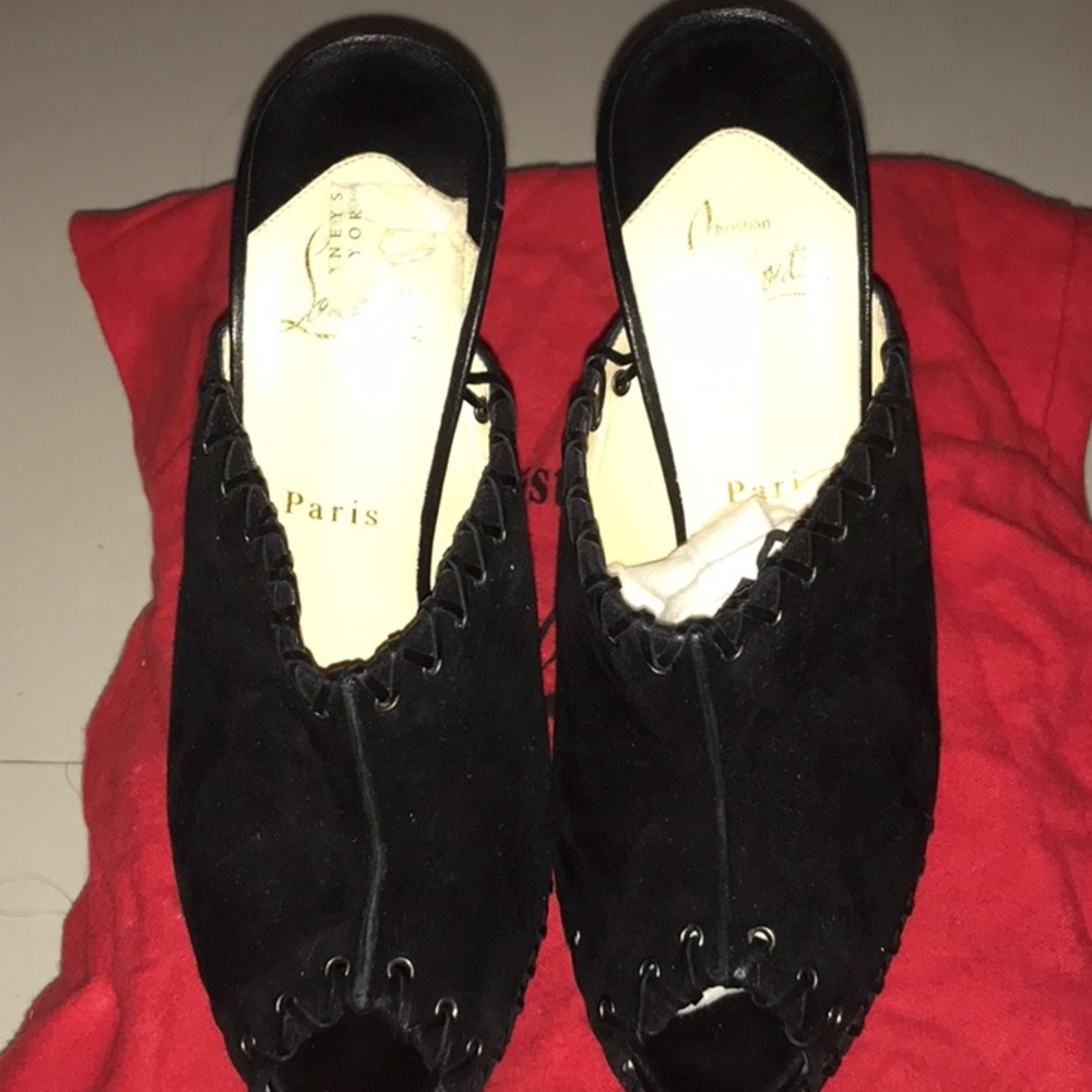 Christan Louboutin 
Black Peep Toe Mules
Great for end of winter/spring
sexy